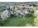 Aerial view of a suburban neighborhood showcasing its proximity to parks and green spaces at 20838 Parliament Ct, Parker, CO 80138