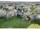 Green space surrounds houses in this aerial view of a residential neighborhood on a nice day at 20838 Parliament Ct, Parker, CO 80138