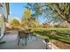 Outdoor living area with patio seating and grill, overlooking a large green field at 20838 Parliament Ct, Parker, CO 80138