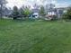 Backyard view with green grassy expanse showing a beautiful setting and view at 20838 Parliament Ct, Parker, CO 80138
