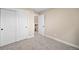 Bedroom with two closets and neutral carpet at 20838 Parliament Ct, Parker, CO 80138