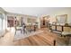 Elegant dining room featuring modern decor, hardwood floors, and large windows at 20838 Parliament Ct, Parker, CO 80138