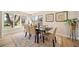 Dining room with a large window and hardwood floors, table set for dinner at 20838 Parliament Ct, Parker, CO 80138