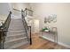 Spacious foyer with staircase, hardwood floors, console table and mirror decor at 20838 Parliament Ct, Parker, CO 80138