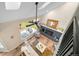 Aerial view of a bright living room featuring a fireplace, large window, and stylish furniture at 20838 Parliament Ct, Parker, CO 80138