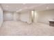 Large basement with bright lighting and neutral carpet, ready for customization at 19346 E Clear Creek Way, Parker, CO 80134