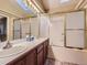 Bright bathroom featuring double sinks and shower at 19346 E Clear Creek Way, Parker, CO 80134