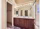 Bright bathroom featuring double sinks and large mirror at 19346 E Clear Creek Way, Parker, CO 80134
