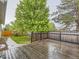 Wooden deck overlooking green yard and lush trees at 19346 E Clear Creek Way, Parker, CO 80134