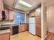 Bright kitchen featuring wood cabinets, granite countertops and stainless steel dishwasher at 19346 E Clear Creek Way, Parker, CO 80134