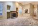 Open living area with a fireplace, large windows, and view into the adjacent kitchen at 19346 E Clear Creek Way, Parker, CO 80134