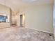 Open-concept living area with view to the entry and kitchen, offering great flow and light at 19346 E Clear Creek Way, Parker, CO 80134