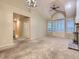 Spacious living room with vaulted ceilings, a cozy fireplace, and ample natural light at 19346 E Clear Creek Way, Parker, CO 80134