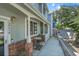 Inviting exterior view with a cozy porch, perfect for relaxing and enjoying the outdoors at 12943 Lafayette St # F, Thornton, CO 80241