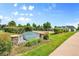 Marina Club at Hunters Lake community sign with lush landscaping at 12943 Lafayette St # F, Thornton, CO 80241