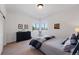 Serene bedroom with calming colors, a dresser, and corner windows with mountain views at 290 Skyhill Dr, Evergreen, CO 80439