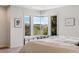 Bright bedroom featuring a large corner window with scenic mountain views at 290 Skyhill Dr, Evergreen, CO 80439