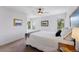 Well-lit bedroom with neutral colors, a ceiling fan, and picturesque views at 290 Skyhill Dr, Evergreen, CO 80439