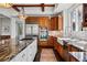 Spacious kitchen with wood cabinets, stainless steel appliances, and a large center island at 290 Skyhill Dr, Evergreen, CO 80439