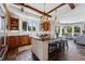 Spacious kitchen with wooden cabinets, granite countertops, and stainless steel appliances at 290 Skyhill Dr, Evergreen, CO 80439