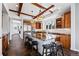 Gourmet kitchen featuring granite countertops, stainless steel appliances, and wood beams at 290 Skyhill Dr, Evergreen, CO 80439