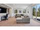 Cozy living room with plush seating, built-in shelving, and picturesque views at 290 Skyhill Dr, Evergreen, CO 80439
