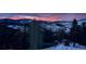 Scenic mountain view at sunset with snow-covered peaks and colorful sky at 290 Skyhill Dr, Evergreen, CO 80439