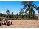 Relaxing outdoor patio with stone flooring, seating area, and breathtaking mountain views at 290 Skyhill Dr, Evergreen, CO 80439