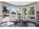 Bright sitting area with panoramic mountain views, slate tile floors and access to the backyard at 290 Skyhill Dr, Evergreen, CO 80439