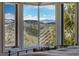Bedroom with a spectacular view of the mountains at 290 Skyhill Dr, Evergreen, CO 80439