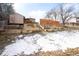 This tiered backyard has wooden retaining walls and landscaping to make the most of the outdoor space at 7551 S Garland St, Littleton, CO 80128