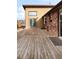 The expansive wooden deck provides ample space for outdoor seating and entertainment with brick and siding at 7551 S Garland St, Littleton, CO 80128