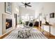 Bright, spacious primary bedroom with fireplace and sitting area at 7551 S Garland St, Littleton, CO 80128