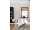 Close-up of a workspace, highlighting a clear glass desk and natural light at 7551 S Garland St, Littleton, CO 80128