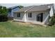 View of the backyard with a small concrete patio and grass at 18784 E Linvale Pl, Aurora, CO 80013