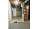 An unfinished basement space with exposed utilities and a door to the outside at 18784 E Linvale Pl, Aurora, CO 80013