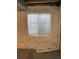 An unfinished basement room with a window and plastic sheeting on the walls at 18784 E Linvale Pl, Aurora, CO 80013