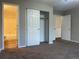 Spacious bedroom featuring a walk-in closet, neutral color scheme and plush carpeting at 18784 E Linvale Pl, Aurora, CO 80013