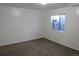 Bedroom with carpet and window, neutral color scheme at 18784 E Linvale Pl, Aurora, CO 80013