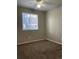 Bedroom boasting carpet, a ceiling fan, and a window offering natural light at 18784 E Linvale Pl, Aurora, CO 80013