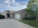 Charming one-story brick home featuring an attached two-car garage and a well-manicured front lawn at 18784 E Linvale Pl, Aurora, CO 80013