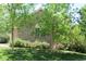 A lush green lawn and trees add to the charm of this home's exterior at 18784 E Linvale Pl, Aurora, CO 80013