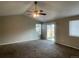 Bright living room features neutral walls, carpet floors, a fan, and natural light at 18784 E Linvale Pl, Aurora, CO 80013