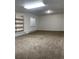 An empty room with neutral carpeting, a window, and shelving on the wall at 18784 E Linvale Pl, Aurora, CO 80013