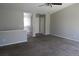 Open-concept living room with neutral walls, carpet, and access to an upper level at 18784 E Linvale Pl, Aurora, CO 80013
