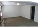 A naturally lit living room featuring neutral carpeting and white walls at 18784 E Linvale Pl, Aurora, CO 80013