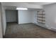 An empty room with neutral carpeting and shelving on the wall at 18784 E Linvale Pl, Aurora, CO 80013
