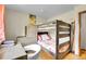 Bedroom with wooden bunk beds, desk, and ski decor at 30400 Hilltop Dr, Evergreen, CO 80439