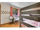 Bedroom with a desk, chair, and wooden bunk beds at 30400 Hilltop Dr, Evergreen, CO 80439