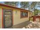 Charming home features a covered entry and well-maintained exterior at 30400 Hilltop Dr, Evergreen, CO 80439